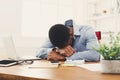 Sleeping overworking black businessman with laptop Royalty Free Stock Photo