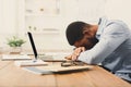 Sleeping overworking black businessman with laptop