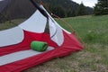 Sleeping pad in open green 2-wall tent in the morning in mountain pass in Mala Fatra mountains, Slovakia Royalty Free Stock Photo