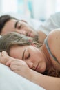 Sleeping, peace and couple in a bed with love, safety and security, comfort and bonding in their home. Relax, sleep and Royalty Free Stock Photo