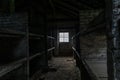 Sleeping quarters with wooden bunk beds showing prisoners terrible living conditions at The Nazi concentration camp of Royalty Free Stock Photo