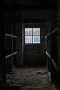 Sleeping quarters with wooden bunk beds showing prisoners terrible living conditions at The Nazi concentration camp of Royalty Free Stock Photo