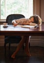 Sleeping, remote work and tired woman with books, fatigue or snooze while writing in home office. Freelance, burnout or Royalty Free Stock Photo