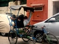 sleeping rickshaw driver in new delhi, india during covid