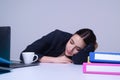 Sleeping secretary. Overworked sleeping Business woman. Young woman sleep at working place in office. Businesswoman Royalty Free Stock Photo