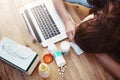 Sleeping, sick and woman with laptop and pills, flu and burnout in the workplace, medicine and tired. Female person Royalty Free Stock Photo