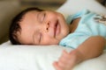 Sleeping smiling babyboy Royalty Free Stock Photo