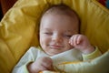 Sleeping smiling newborn baby