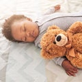 Sleeping, teddy bear and cute with baby in bedroom for carefree, development and innocence. Dreaming, relax and