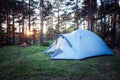 Sleeping tent woods sunset camping. Royalty Free Stock Photo