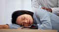 Sleeping, tired and employee with burnout on an office table feeling overworked and sleep on her desk. Nap, dreaming and Royalty Free Stock Photo