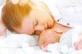 Sleeping together and breastfeeding mother and newborn baby in b