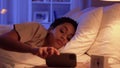 sleeping woman awaking because of phone at night