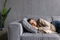 Sleeping young woman taking nap on the sofa during the day Royalty Free Stock Photo