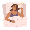 Sleeping woman wearing smart watch in bed