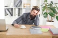 Sleepless night. Depressed mood and lack of energy. Man handsome boss sleep in office drinking coffee. Hard morning Royalty Free Stock Photo