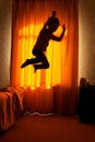 Boy sleepwalker jumping from bed