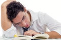 Sleepy adult man with glasses in white shirt and tie sitting wit