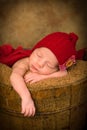 Sleepy baby in grunge bucket Royalty Free Stock Photo