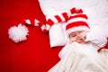 Sleepy baby on red blanket Royalty Free Stock Photo