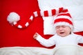 Sleepy baby on red blanket Royalty Free Stock Photo