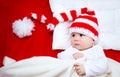 Sleepy baby on red blanket Royalty Free Stock Photo