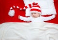 Sleepy baby on red blanket Royalty Free Stock Photo