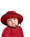 Sleepy baby in red hat. Royalty Free Stock Photo