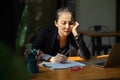 Sleepy and bored businesswoman sitting at her office desk Royalty Free Stock Photo