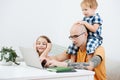 Sleepy dad working home during isolation, his kids make him their entertainment