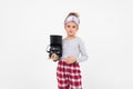 Sleepy girl in pajamas just woke up and yawns while holding a coffee machine on a white background with copy space Royalty Free Stock Photo