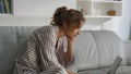 Sleepy lady using laptop in pajamas closeup. Office worker stretch yawn indoors Royalty Free Stock Photo