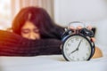 Sleepy lazy Asian teen girl still in bed wake up Royalty Free Stock Photo