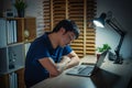 sleepy man working with laptop at night Royalty Free Stock Photo