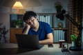 sleepy man working with laptop at night Royalty Free Stock Photo