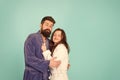 Sleepy people blue background. Couple sleepy faces domestic clothes. All day pajamas. Couple in love bathrobes. Drowsy