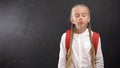 Sleepy schoolgirl yawning on camera against blackboard, tiredness after lessons