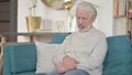 Sleepy Senior Old Man taking Nap Sitting at Home Royalty Free Stock Photo