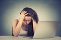 Sleepy stressed young woman sitting at her desk in front of computer Royalty Free Stock Photo