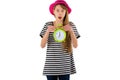 Sleepy Teen Girl holding alarm Clock, isolated on white wall. Portrait of caucasian teenager showing alarm clock