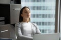 Sleepy tired businesswoman sitting at desk with closed eyes Royalty Free Stock Photo