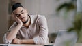 Sleepy tired hispanic man employee male businessman dreamer sleeping at home office workplace napping has rest arabian Royalty Free Stock Photo