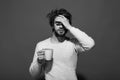 Sleepy tired man with headache hold cup of tea Royalty Free Stock Photo