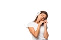 Sleepy woman with closed eyes listening music with headphones, isolated on white