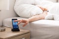 Sleepy Woman Snoozing Alarm On Phone