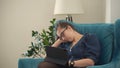 Sleepy Young leader Woman in glasses Chatting Laptop Living Room. Writing Searching Using IT. Tired Buisenes Lady Royalty Free Stock Photo