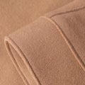 Sleeve of beige woolen coat close up