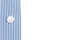 A sleeve of a blue striped shirt with a button on the white background Royalty Free Stock Photo