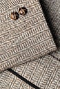 Sleeve of tweed brown jacket