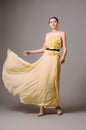 Sleeveless evening gown with fluttering pleating skirt.